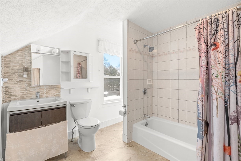 20 Pond Street Stoneham, MA 02180 - Photo 19 of 35 a bathroom with a toilet a sink and bathtub