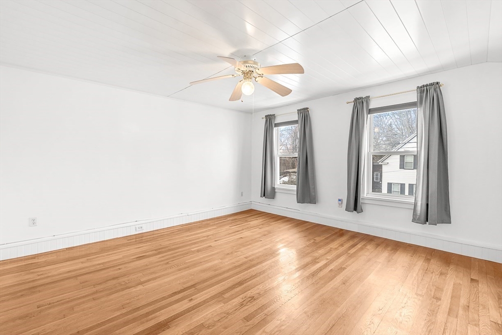 20 Pond Street Stoneham, MA 02180 - Photo 20 of 35 wooden floor in an empty room with a window