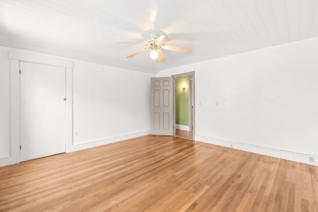 20 Pond Street Stoneham, MA 02180 - Photo 21 of 35 a view of an empty room with wooden floor