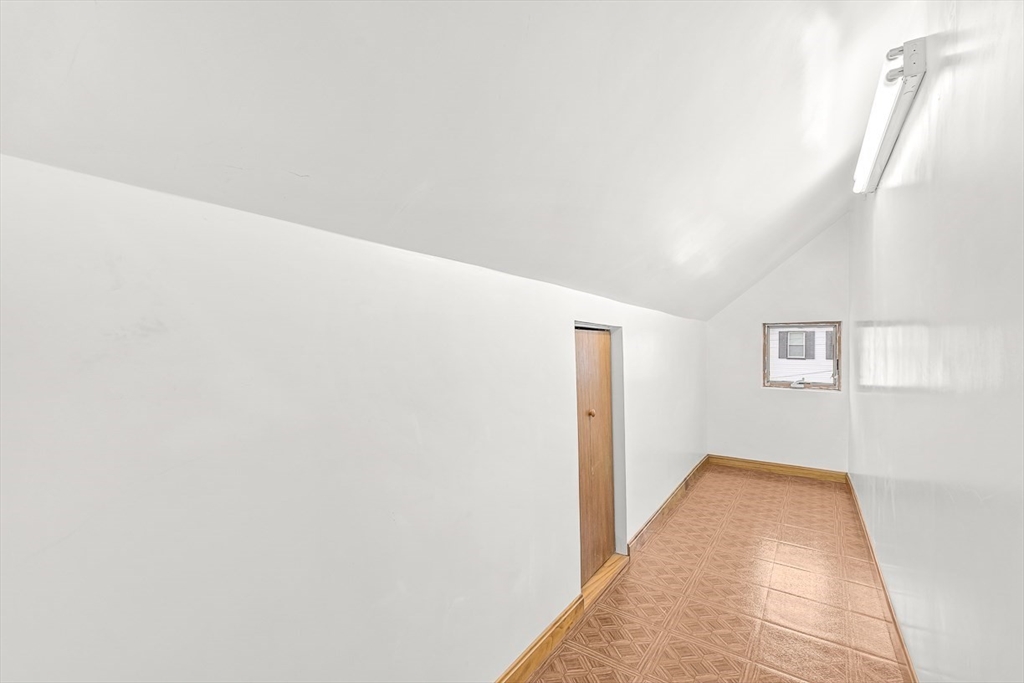 20 Pond Street Stoneham, MA 02180 - Photo 22 of 35 a view of a hallway with wooden floor