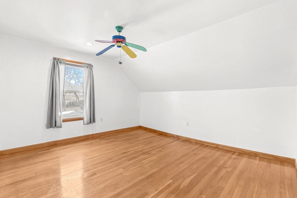 20 Pond Street Stoneham, MA 02180 - Photo 24 of 35 a view of an empty room with wooden floor and window