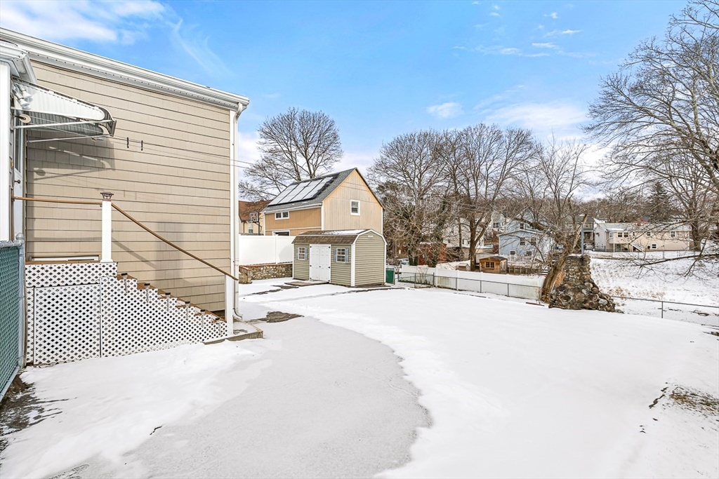 20 Pond Street Stoneham, MA 02180 - Photo 27 of 35 a view of a house with snow on the road