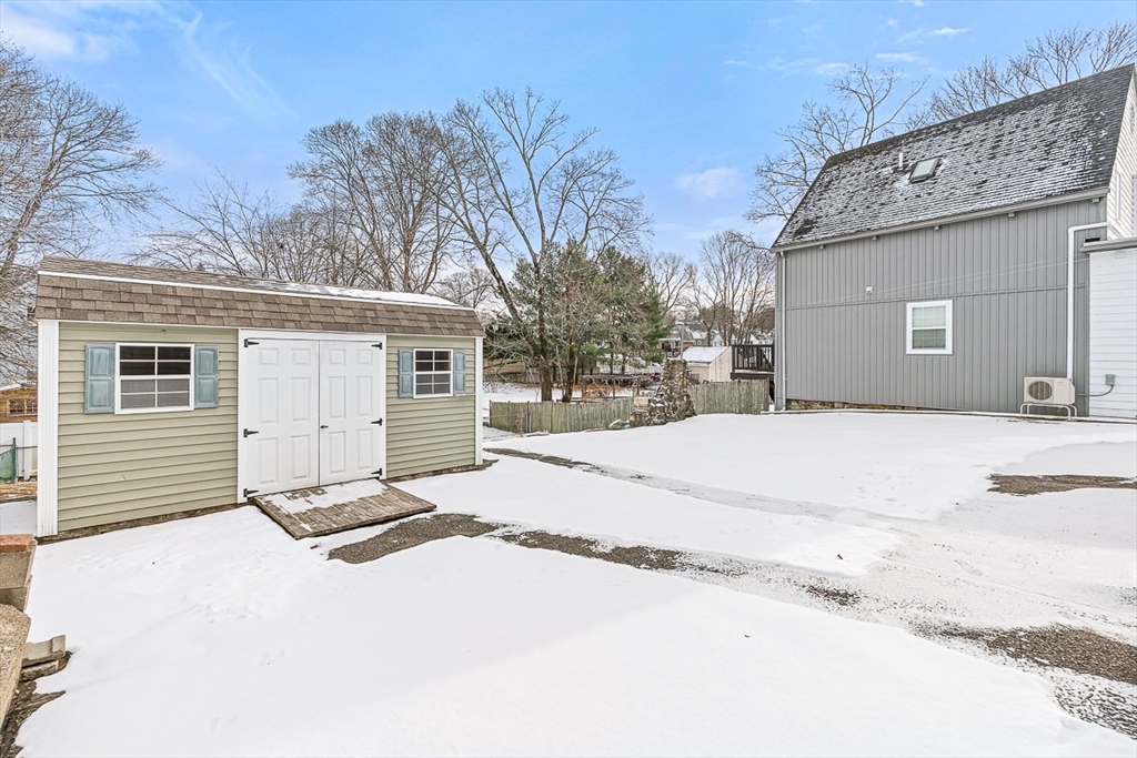 20 Pond Street Stoneham, MA 02180 - Photo 30 of 35 a view of a house with snow on the road