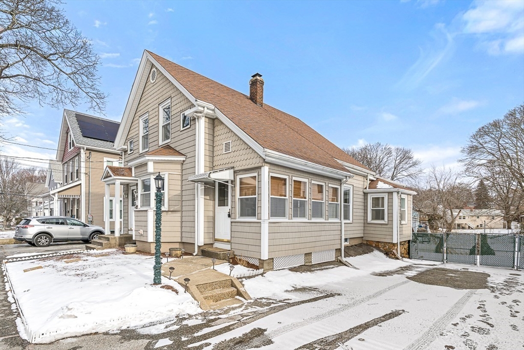 20 Pond Street Stoneham, MA 02180 - Photo 3 of 35 a view of a white house with a yard