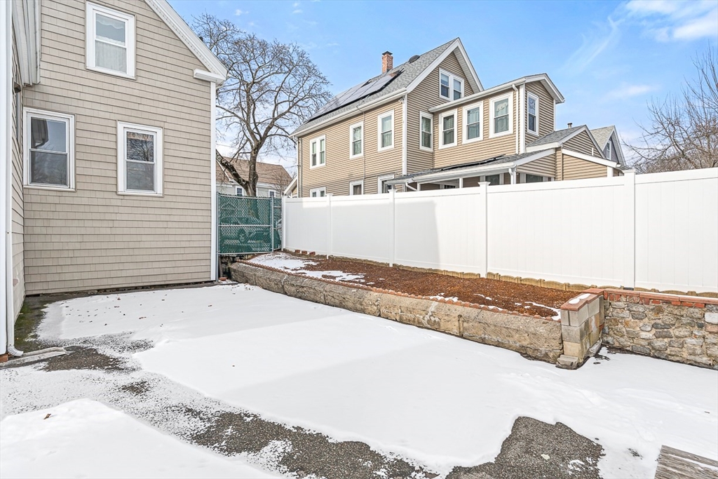 20 Pond Street Stoneham, MA 02180 - Photo 31 of 35 a front view of a house with a yard