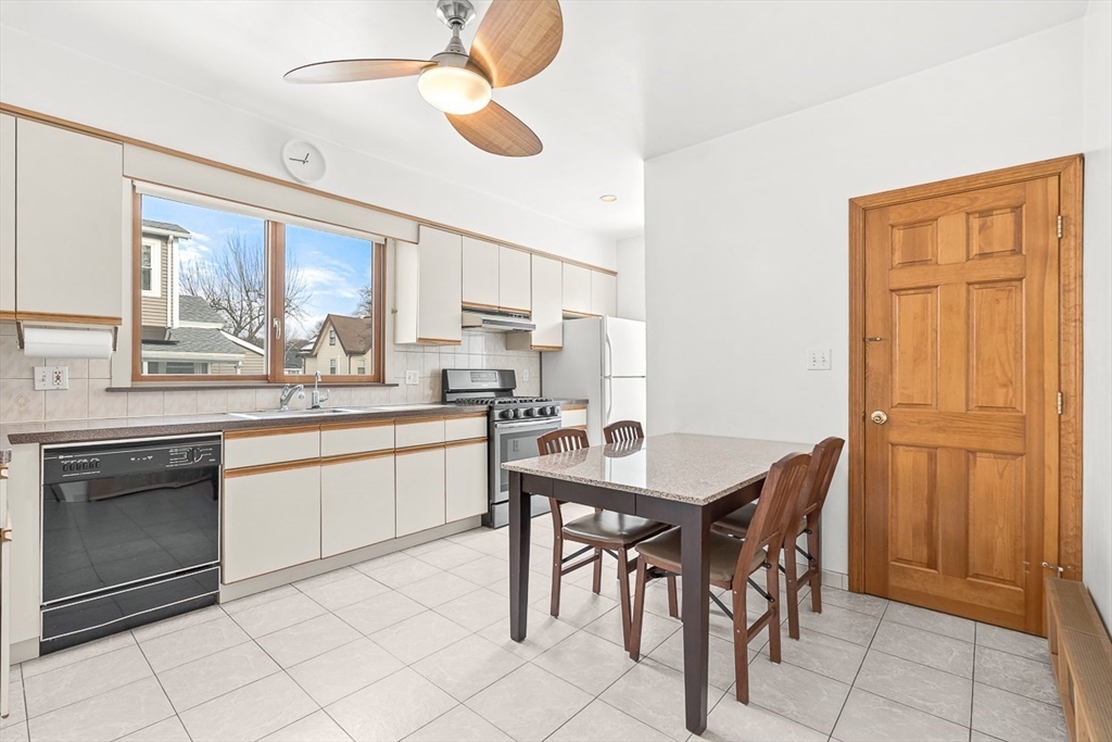 20 Pond Street Stoneham, MA 02180 - Photo 10 of 35 a kitchen with appliances cabinets and chair