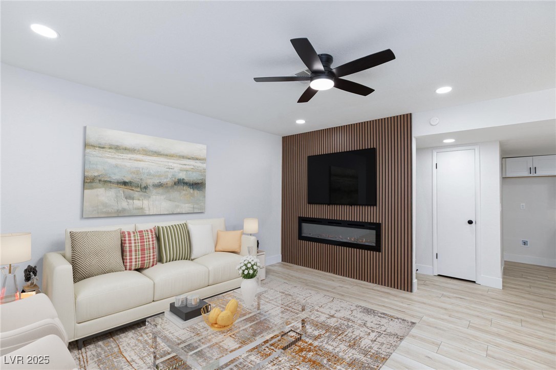 5905 Smoke Ranch Road, Unit A Las Vegas, NV 89108 - Photo 1 of 31 Living area featuring recessed lighting, a ceiling fan, light wood-style flooring, and a fireplace