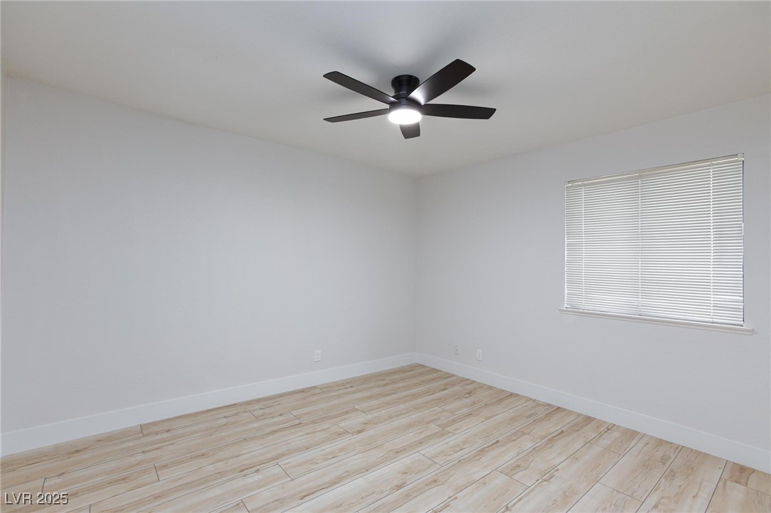 5905 Smoke Ranch Road, Unit A Las Vegas, NV 89108 - Photo 23 of 31 Unfurnished room featuring light wood-style flooring and ceiling fan