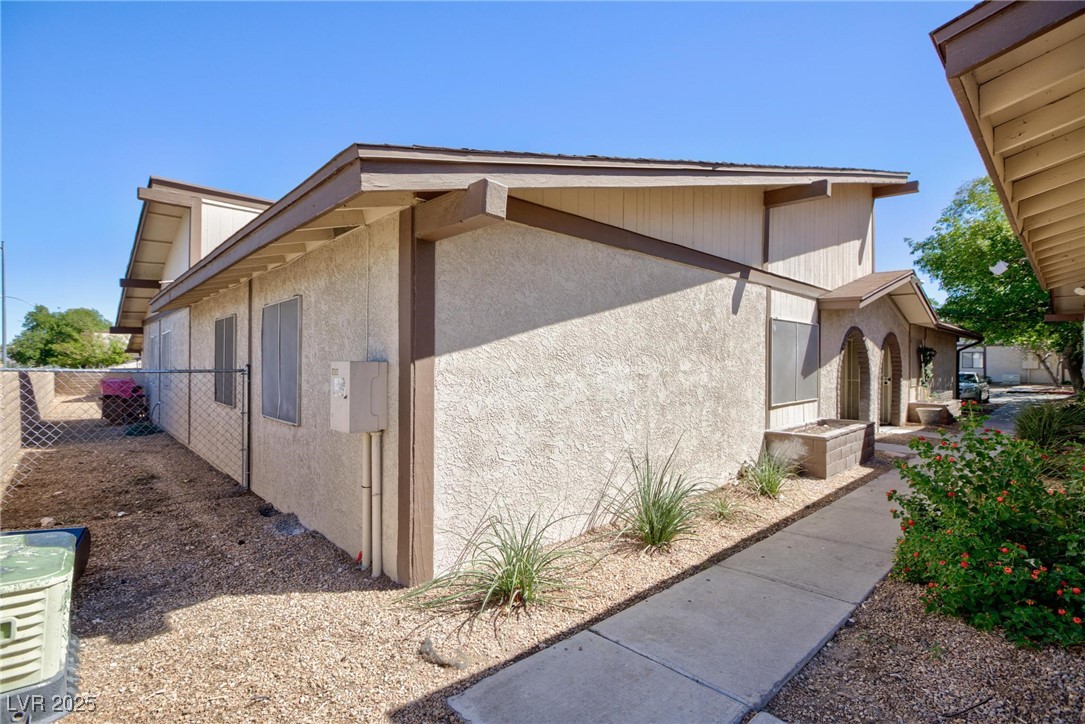 5905 Smoke Ranch Road, Unit A Las Vegas, NV 89108 - Photo 30 of 31 View of home's exterior featuring stucco siding