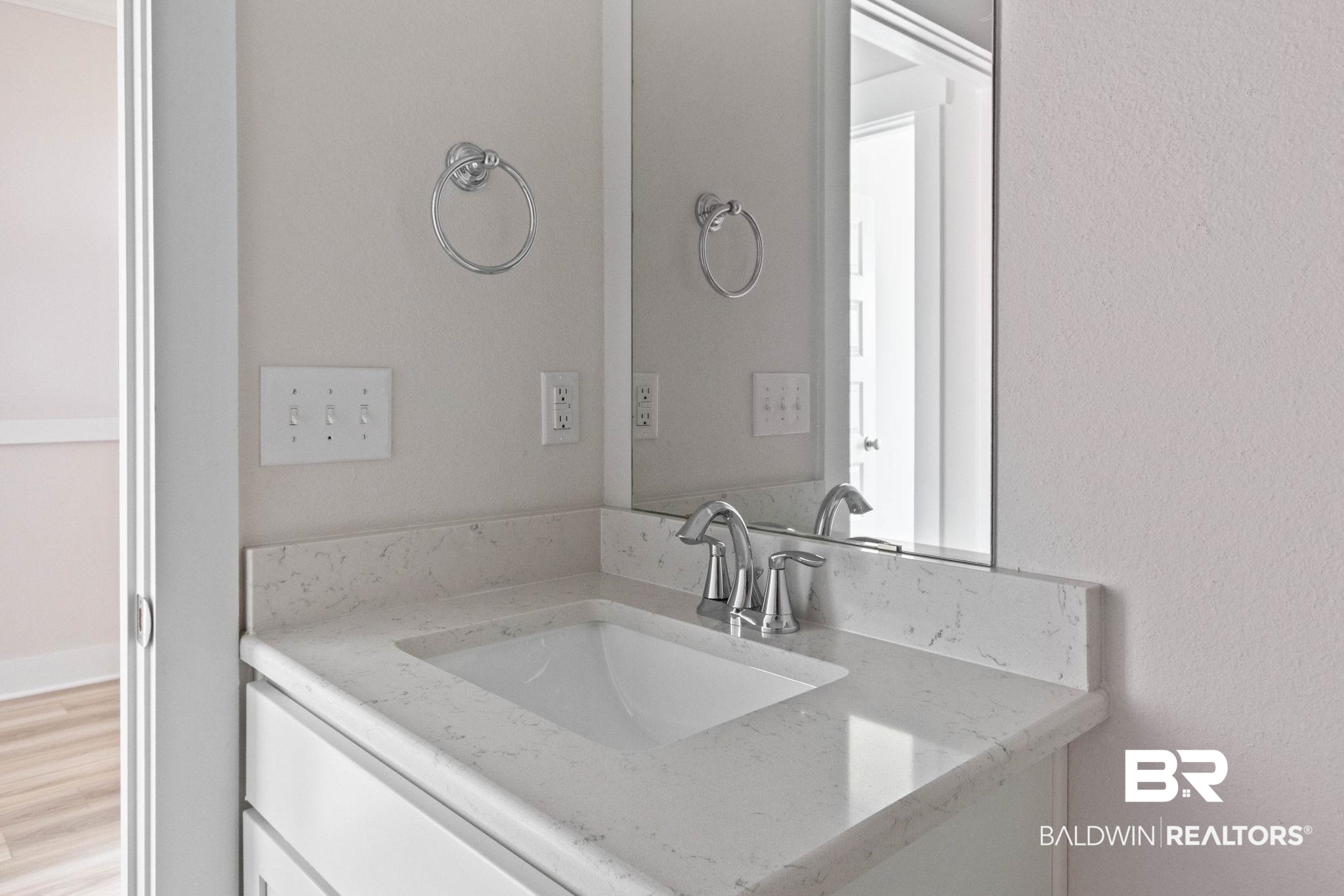 1710 Grouse Street Foley, AL 36535 - Photo 59 of 76 Vanity with an integrated rectangular sink, stone-finish countertop, and chrome faucet