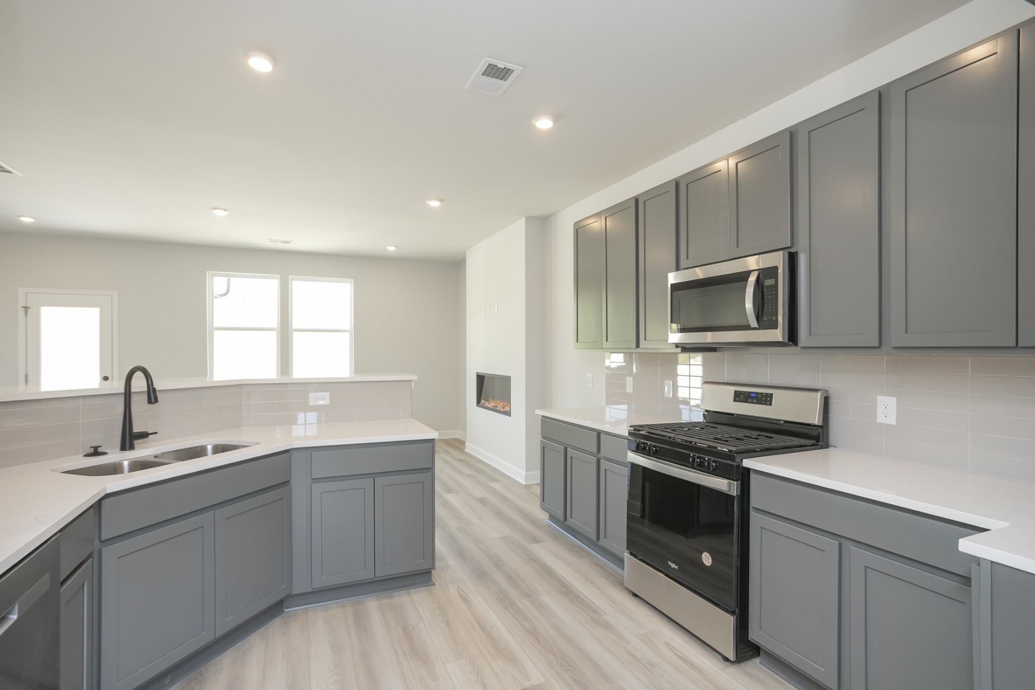 128 Millbrook Dr Spring Hill Spring Hill, TN 37174 - Photo 12 of 19 a kitchen with a sink stove top oven and microwave