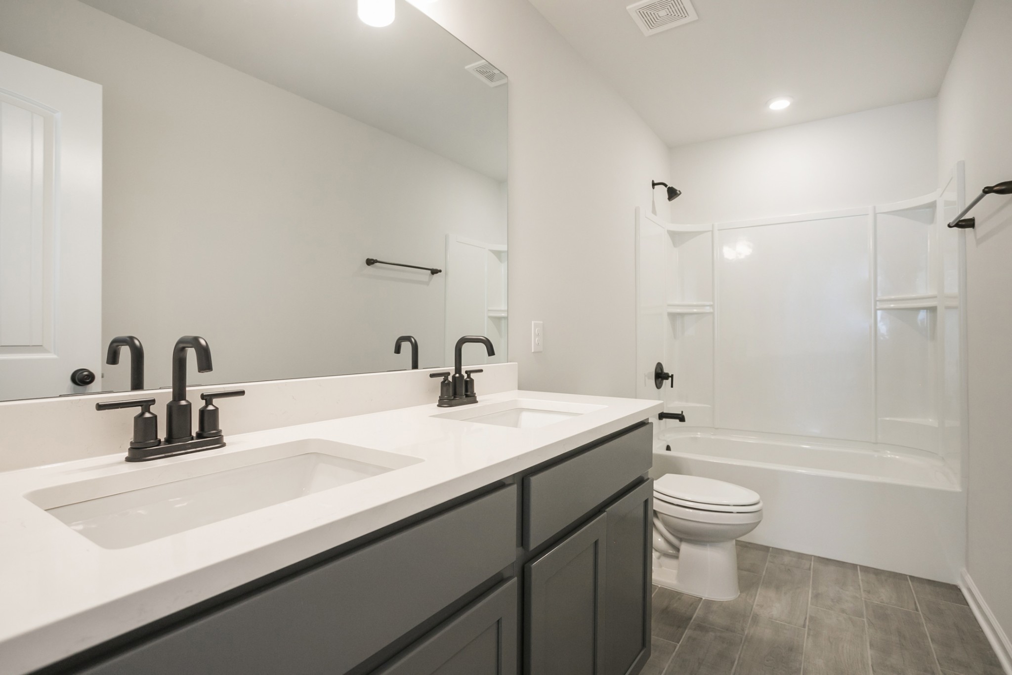 128 Millbrook Dr Spring Hill Spring Hill, TN 37174 - Photo 18 of 19 a bathroom with a granite countertop sink a toilet and bathtub