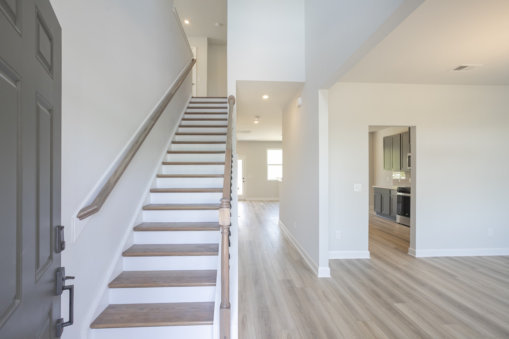 128 Millbrook Dr Spring Hill Spring Hill, TN 37174 - Photo 6 of 19 a view of a hallway with wooden floor and entryway