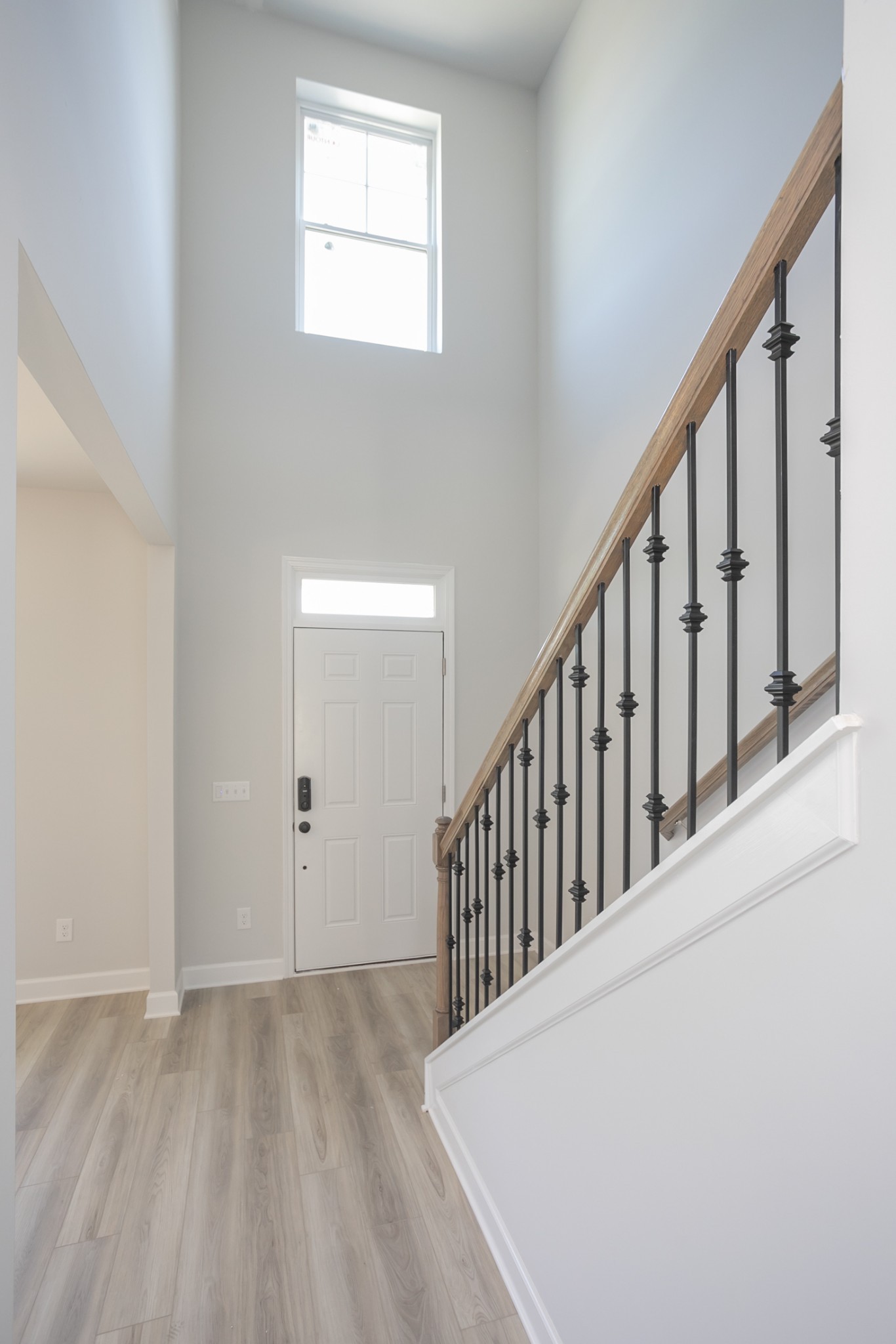 128 Millbrook Dr Spring Hill Spring Hill, TN 37174 - Photo 7 of 19 a view of a hallway with wooden floor and entryway