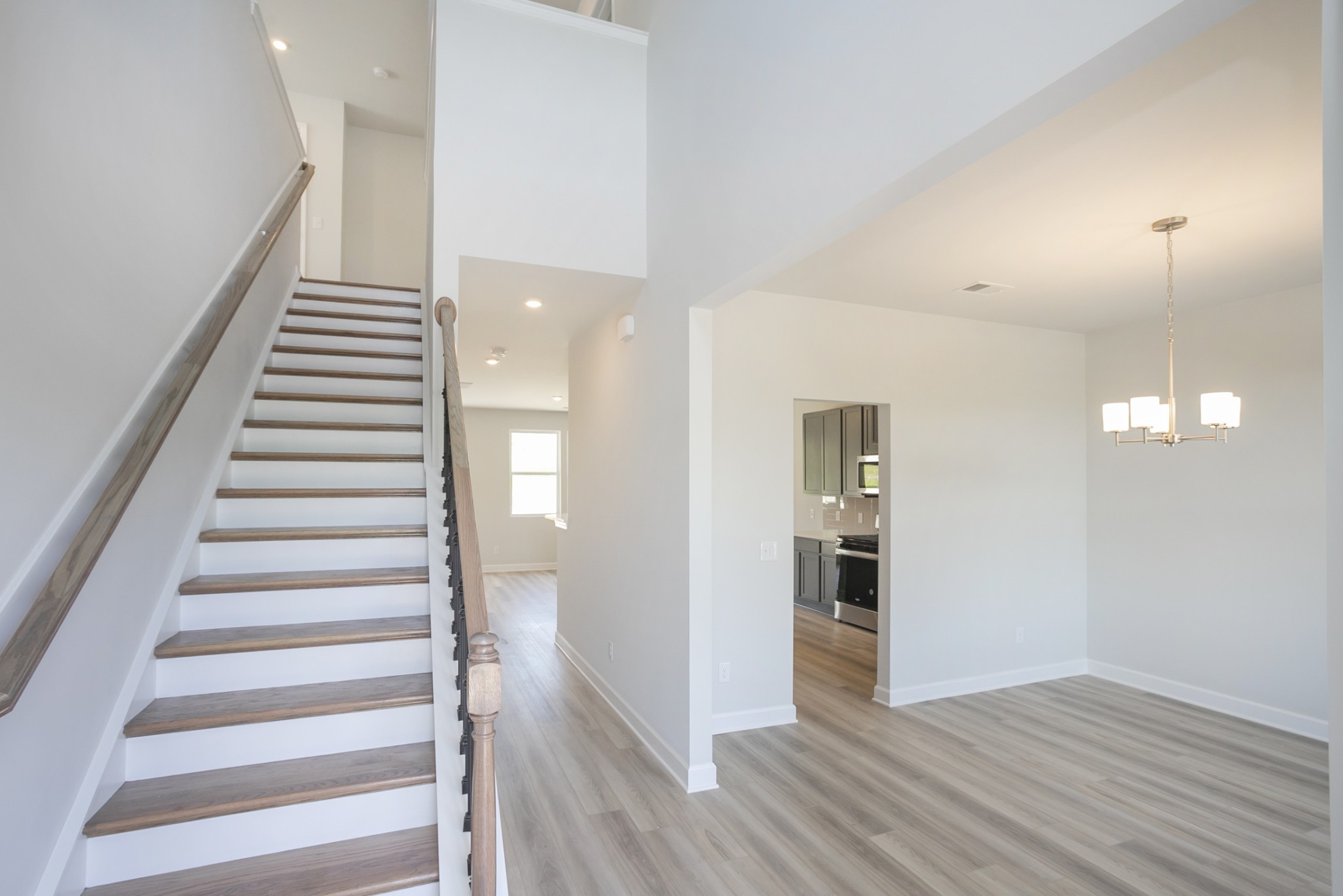128 Millbrook Dr Spring Hill Spring Hill, TN 37174 - Photo 8 of 19 a view of a hallway with wooden floor and entryway