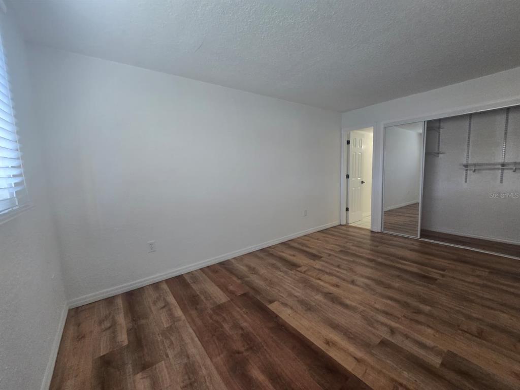 902 Lake Destiny Road, Unit C Altamonte Springs, FL 32714 - Photo 13 of 23 a view of empty room with wooden floor