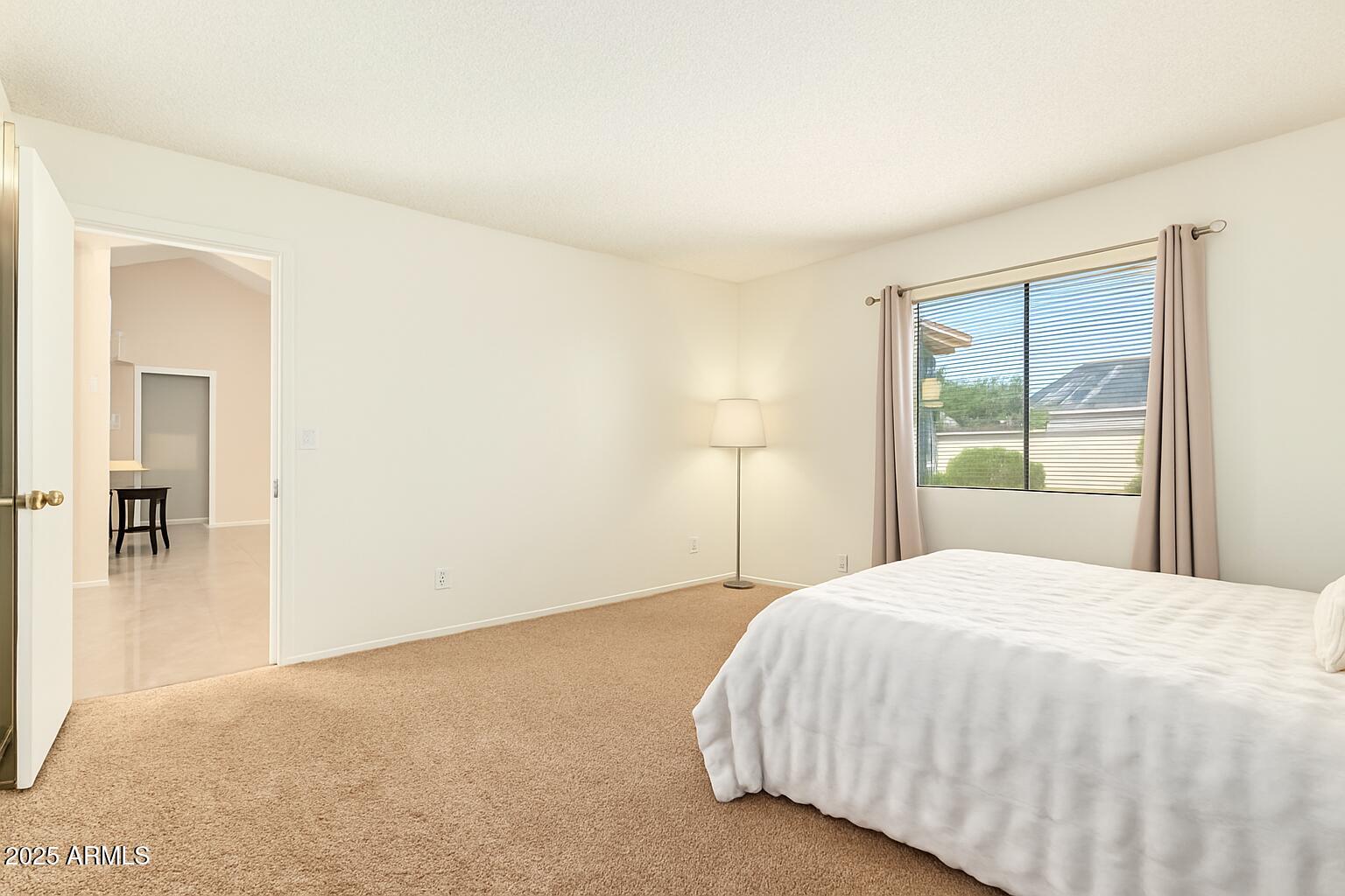1312 East Stephens Drive Tempe, AZ 85283 - Photo 13 of 26 a bedroom with a bed and a window