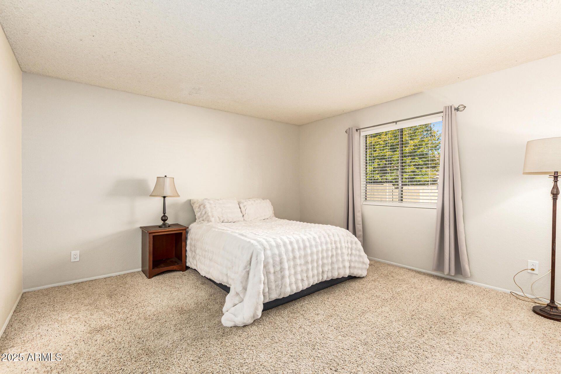 1312 East Stephens Drive Tempe, AZ 85283 - Photo 16 of 26 a bedroom with a bed and a window