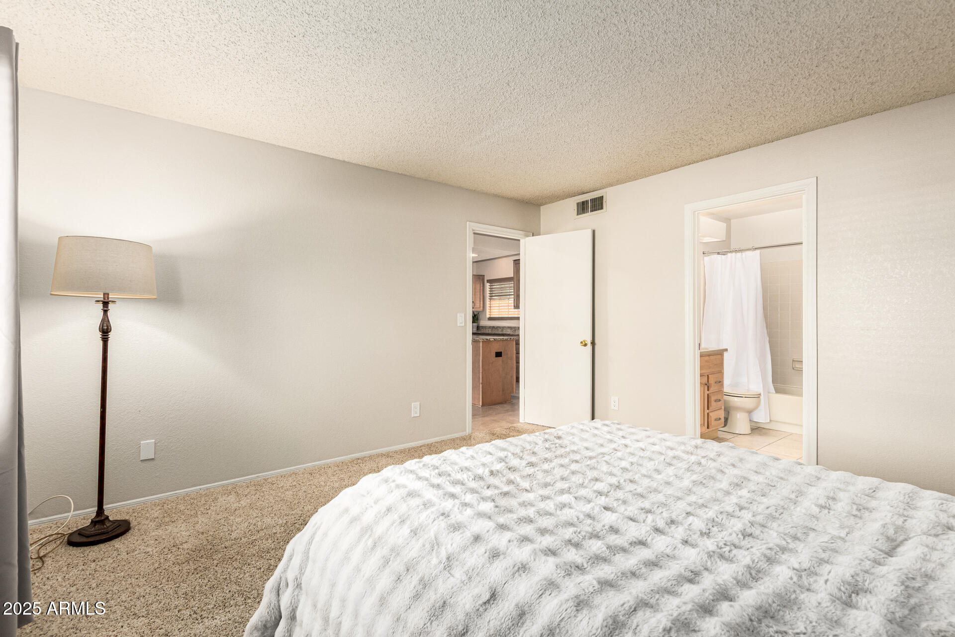 1312 East Stephens Drive Tempe, AZ 85283 - Photo 18 of 26 a bedroom with a bed and a dresser