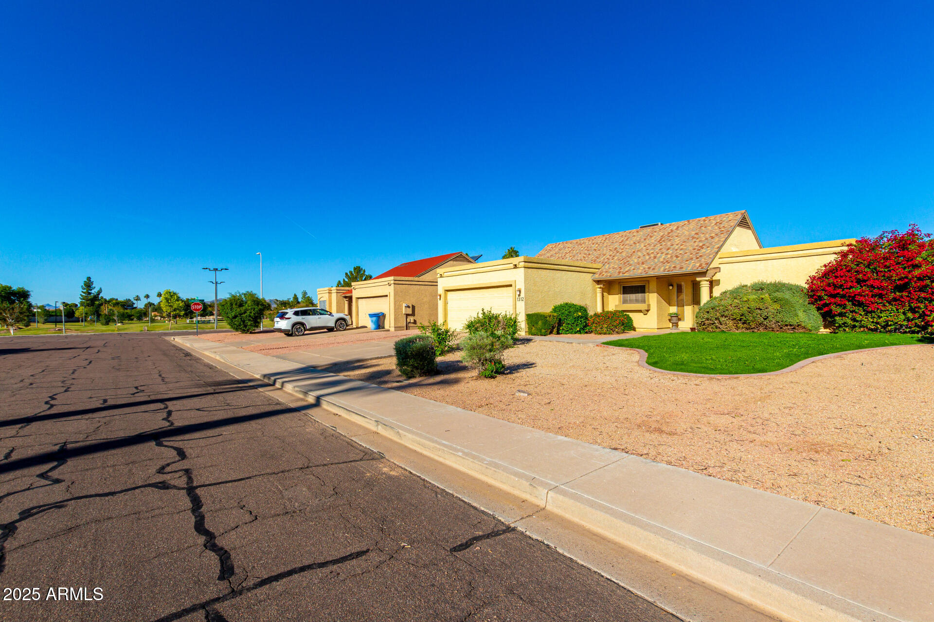 1312 East Stephens Drive Tempe, AZ 85283 - Photo 2 of 26 a street view with tall buildings