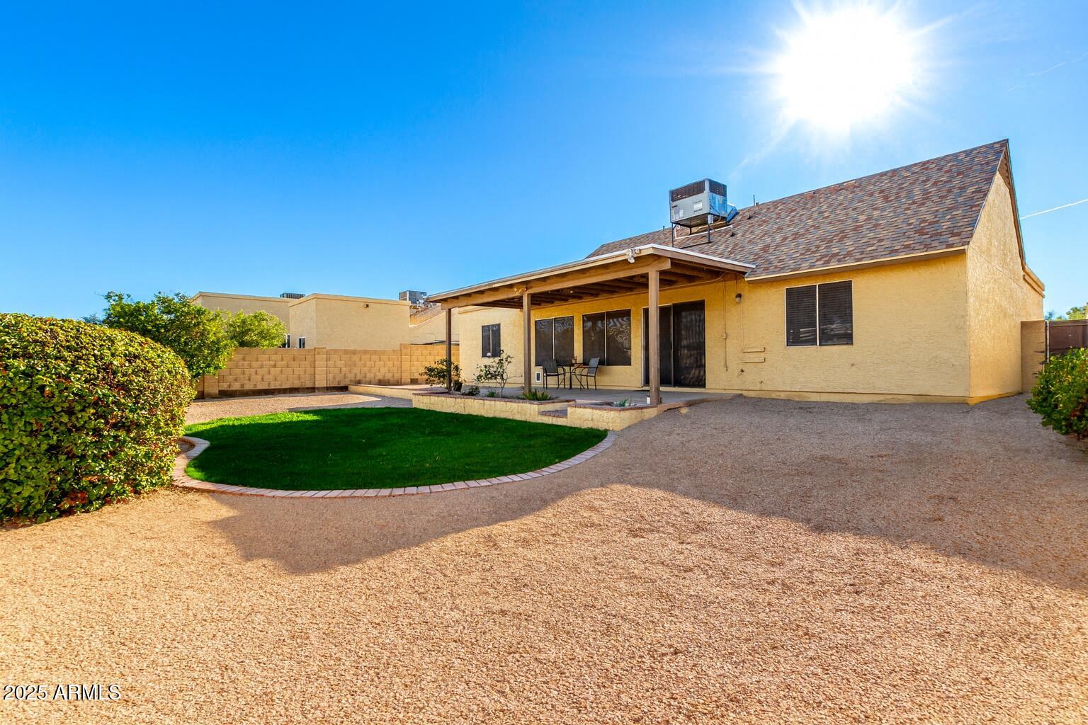 1312 East Stephens Drive Tempe, AZ 85283 - Photo 23 of 26 a view of a house with a backyard