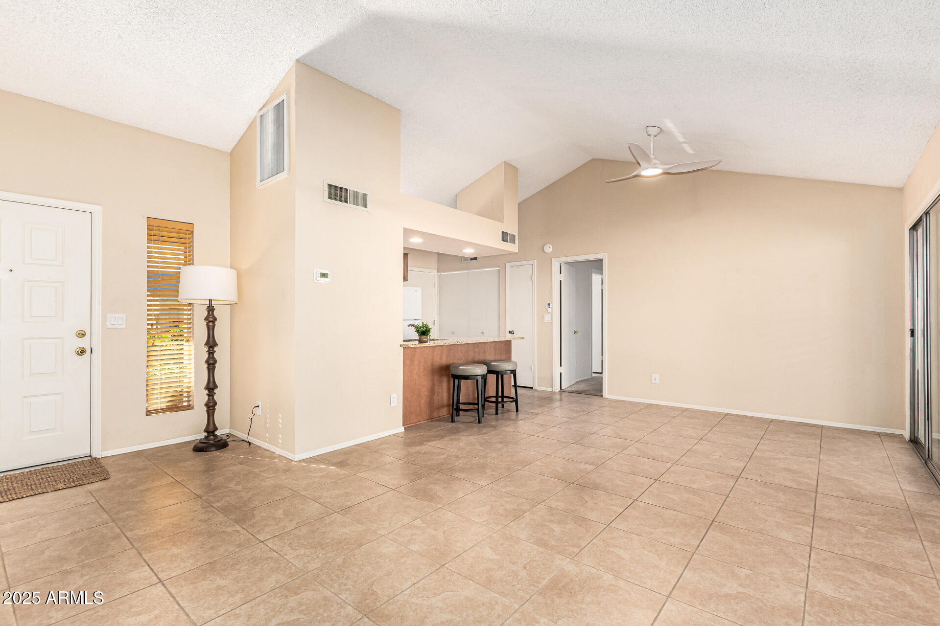1312 East Stephens Drive Tempe, AZ 85283 - Photo 4 of 26 a view of livingroom with furniture and a chandelier