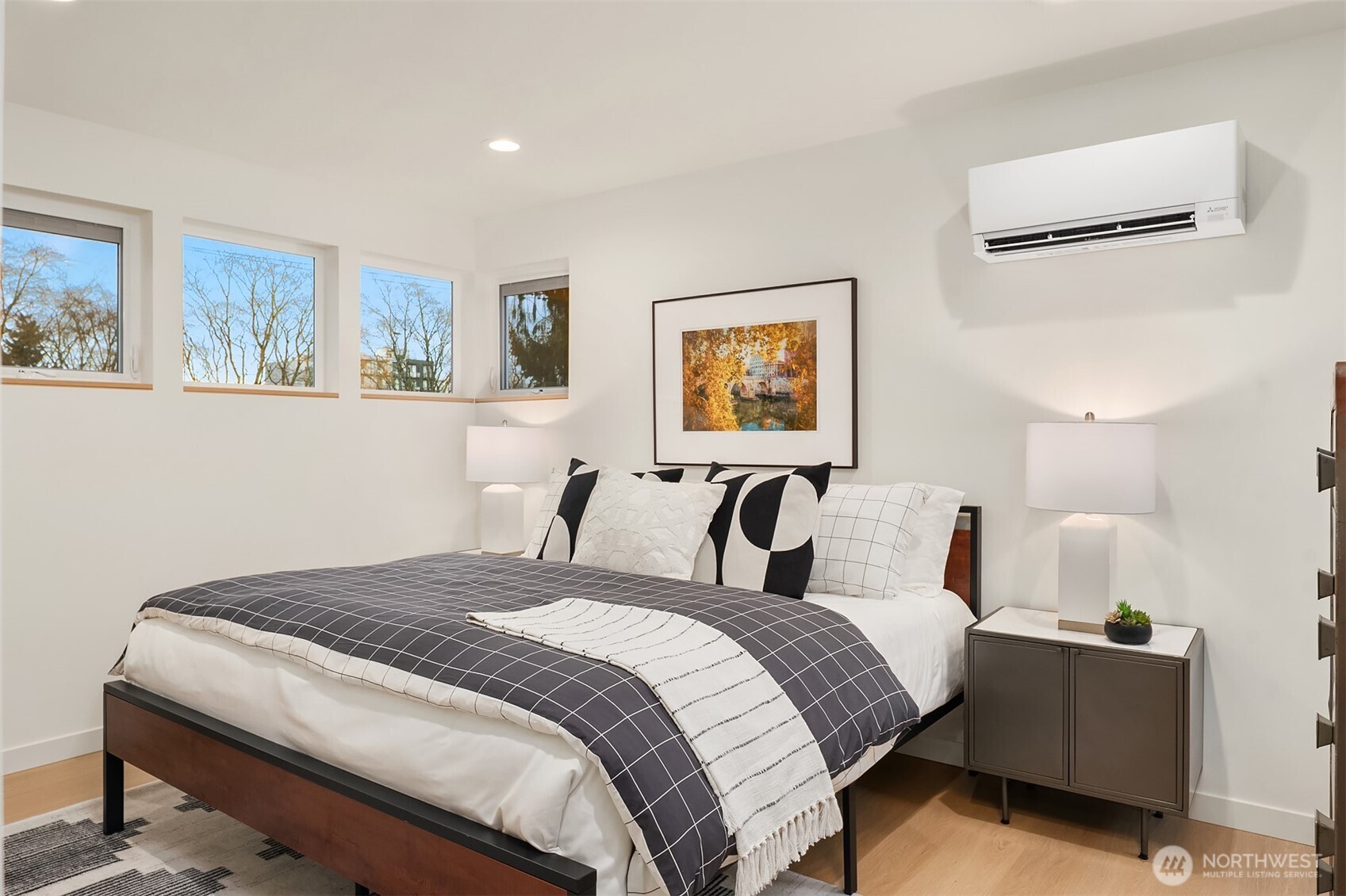 1457 22nd Avenue, Unit A Seattle, WA 98122 - Photo 11 of 15 a bedroom with a bed and a painting on the wall
