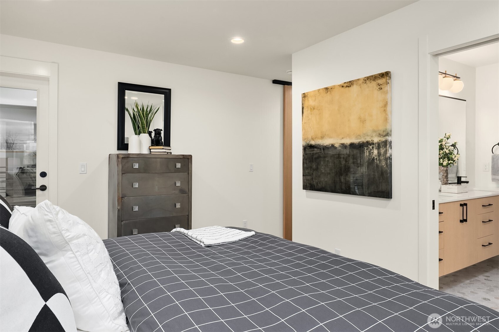 1457 22nd Avenue, Unit A Seattle, WA 98122 - Photo 12 of 15 a bedroom with a bed and a window