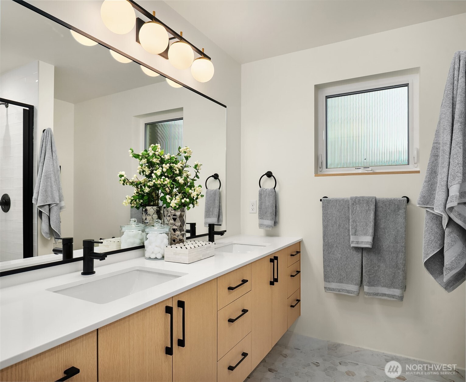 1457 22nd Avenue, Unit A Seattle, WA 98122 - Photo 13 of 15 a bathroom with a sink and a mirror
