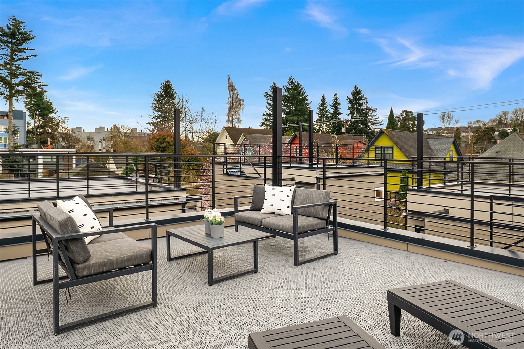 1457 22nd Avenue, Unit A Seattle, WA 98122 - Photo 14 of 15 a view of a terrace with couches and sky view