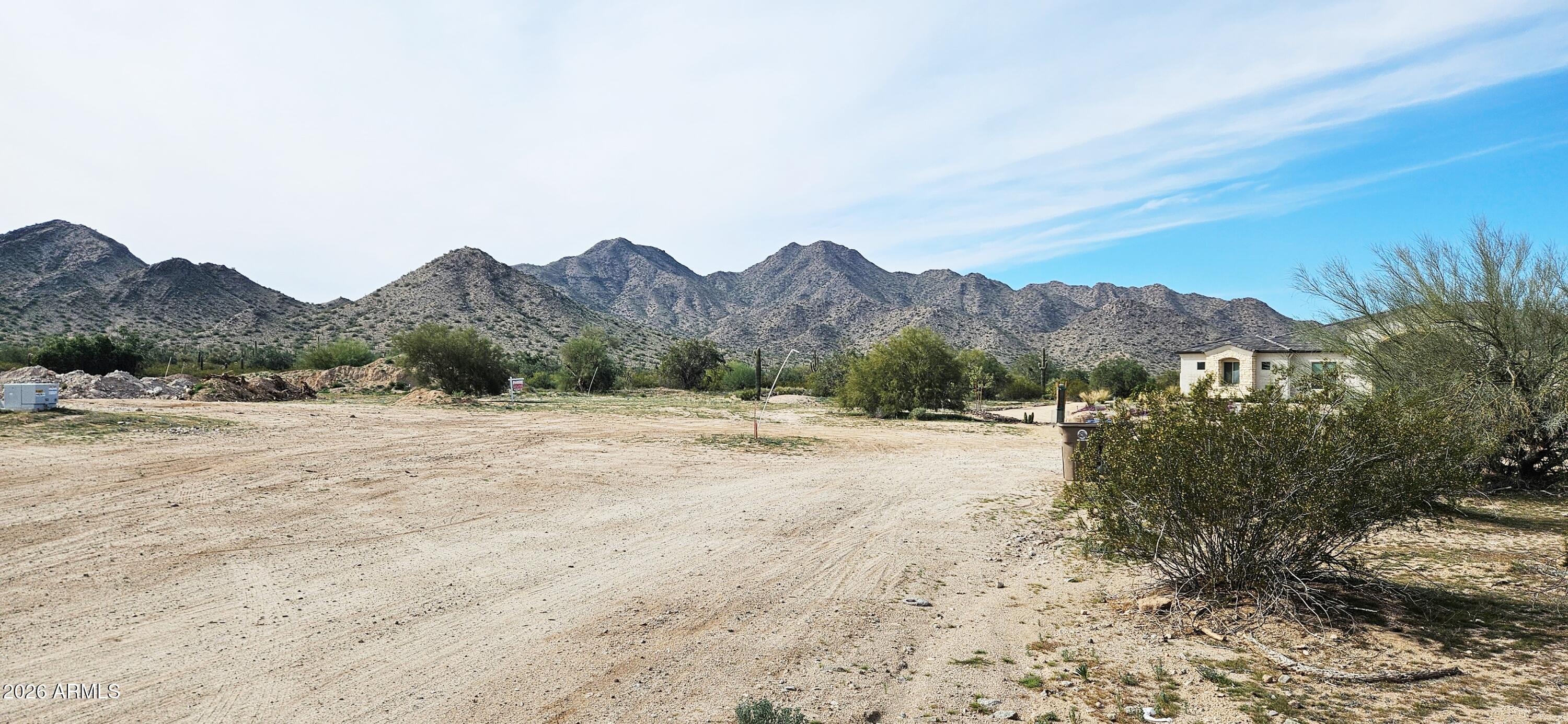 a view of a dry yard with mountain
