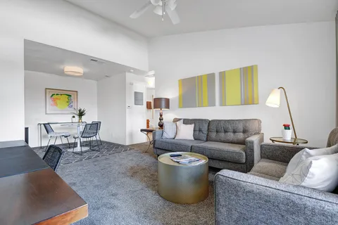 a living room with furniture and a couch