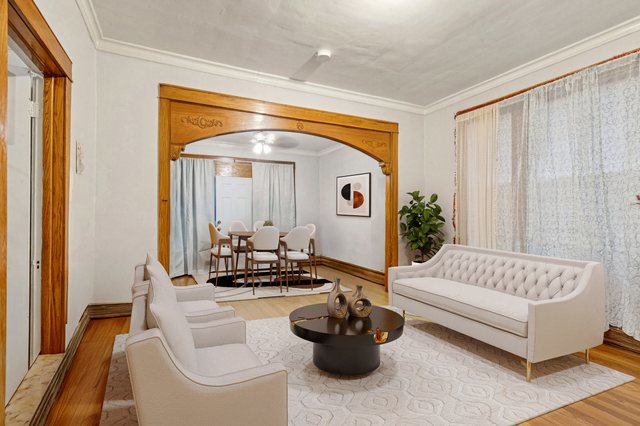 1912 South Harding Avenue Chicago, IL 60623 - Photo 6 of 16 a living room with furniture and a large window
