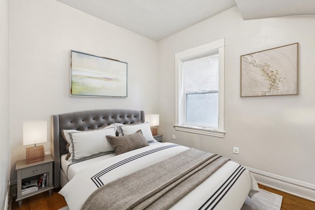 1912 South Harding Avenue Chicago, IL 60623 - Photo 7 of 16 a bedroom with bed and wooden floor