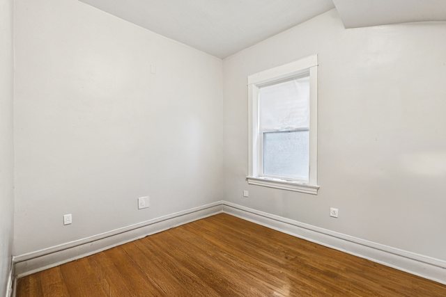 1912 South Harding Avenue Chicago, IL 60623 - Photo 8 of 16 an empty room with wooden floor and windows