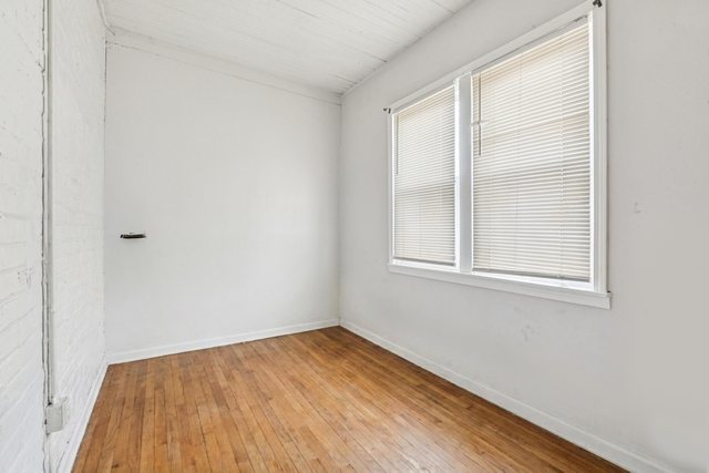 1912 South Harding Avenue Chicago, IL 60623 - Photo 10 of 16 an empty room with a window