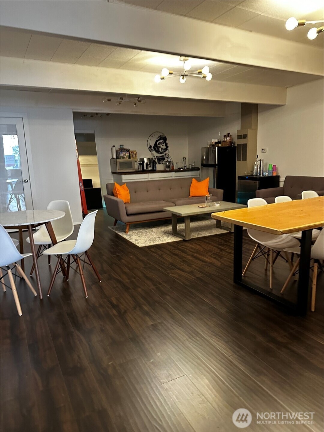447 Southwest 152nd Street, Unit 206 Burien, WA 98166 - Photo 8 of 17 a living room with furniture and a wooden floor