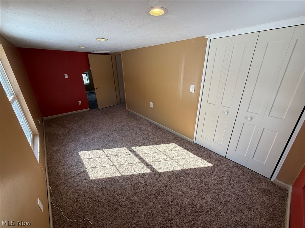 6784 Old Zoarville Road Northeast Dover, OH 44622 - Photo 27 of 50 Unfurnished bedroom featuring carpet floors and a closet