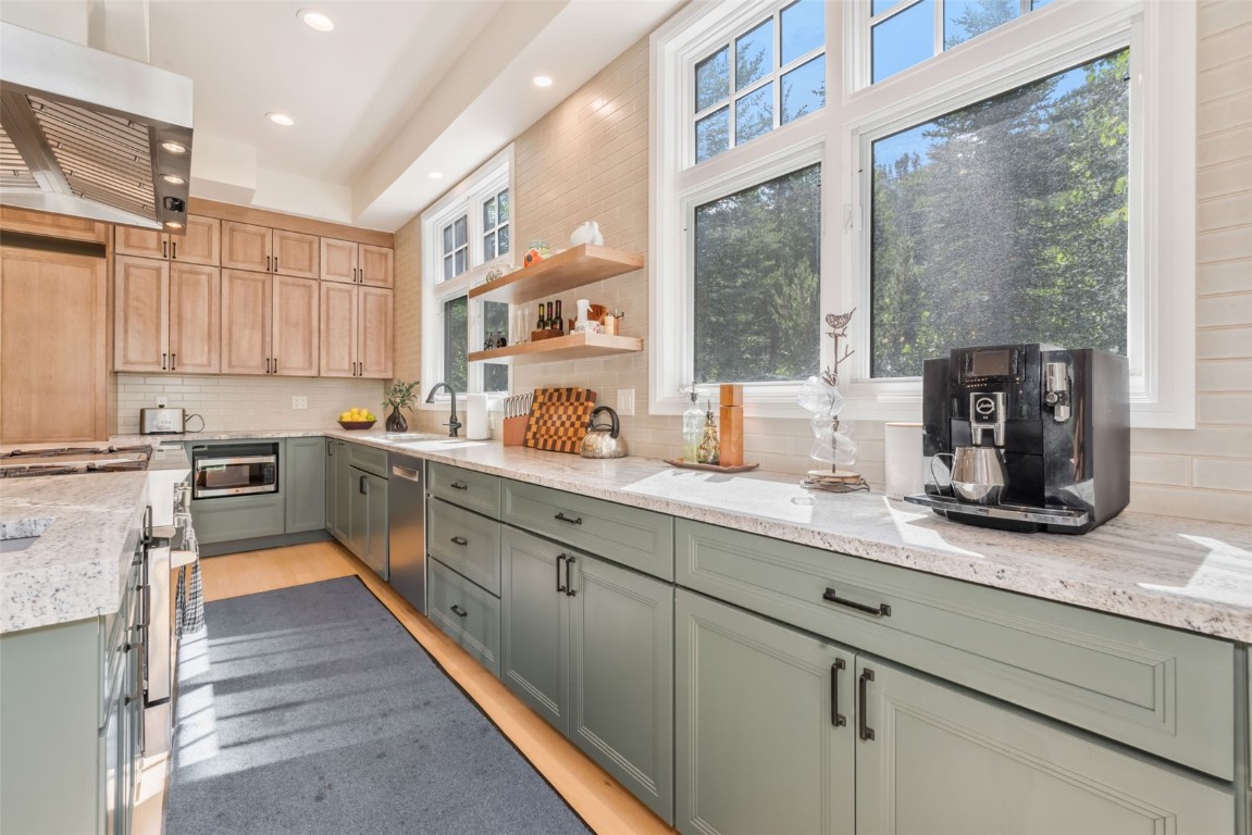 2911 Inverness Way Steamboat Springs, CO 80487 - Photo 16 of 43 a kitchen with counter top space a sink and cabinets