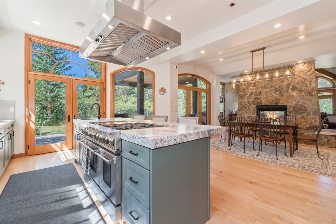 2911 Inverness Way Steamboat Springs, CO 80487 - Photo 17 of 43 a kitchen with stainless steel appliances granite countertop a stove and a wooden floors