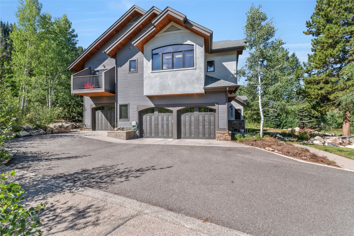 2911 Inverness Way Steamboat Springs, CO 80487 - Photo 2 of 43 a front view of a house with a yard