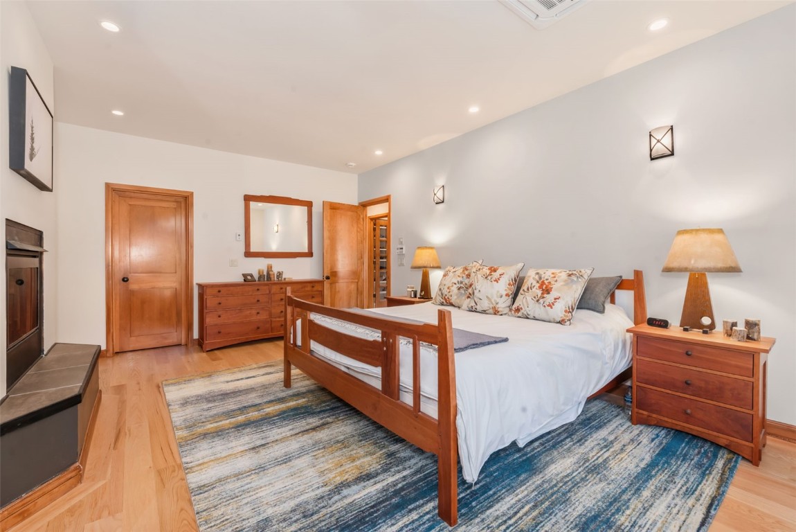 2911 Inverness Way Steamboat Springs, CO 80487 - Photo 25 of 43 a bedroom with a bed and a lamp on table