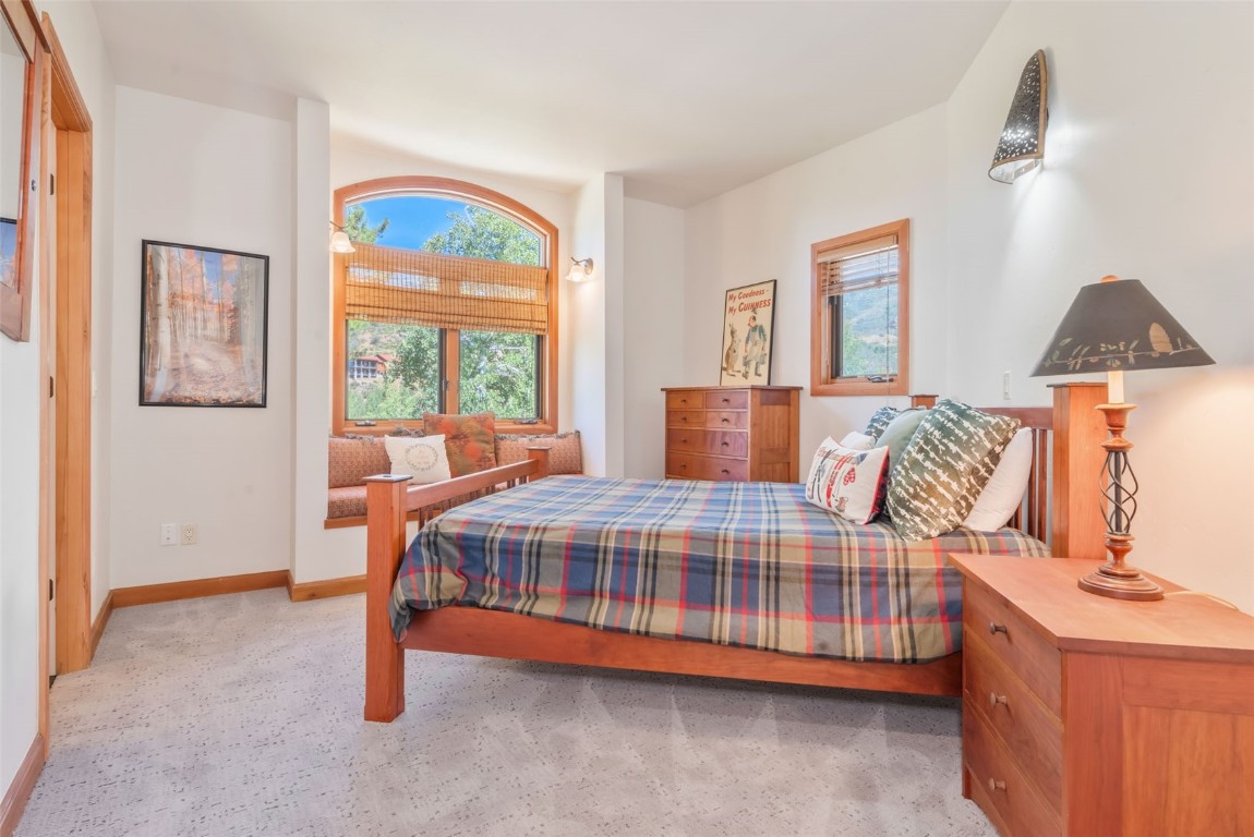 2911 Inverness Way Steamboat Springs, CO 80487 - Photo 30 of 43 a bedroom with a bed and window