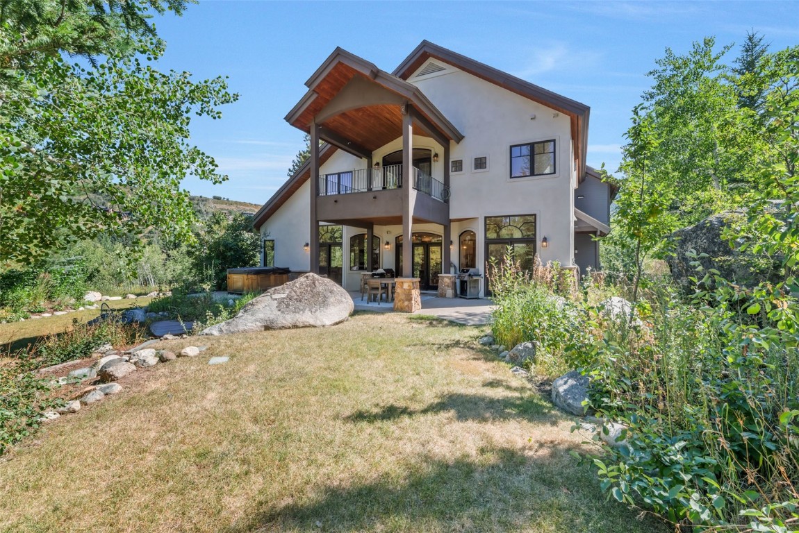 2911 Inverness Way Steamboat Springs, CO 80487 - Photo 3 of 43 a front view of a house with a yard and potted plants