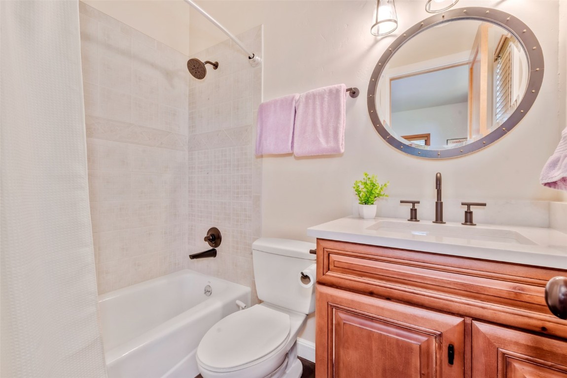 2911 Inverness Way Steamboat Springs, CO 80487 - Photo 32 of 43 a bathroom with a sink a toilet and a mirror