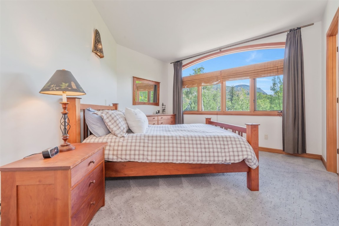 2911 Inverness Way Steamboat Springs, CO 80487 - Photo 34 of 43 a bedroom with a bed and a window