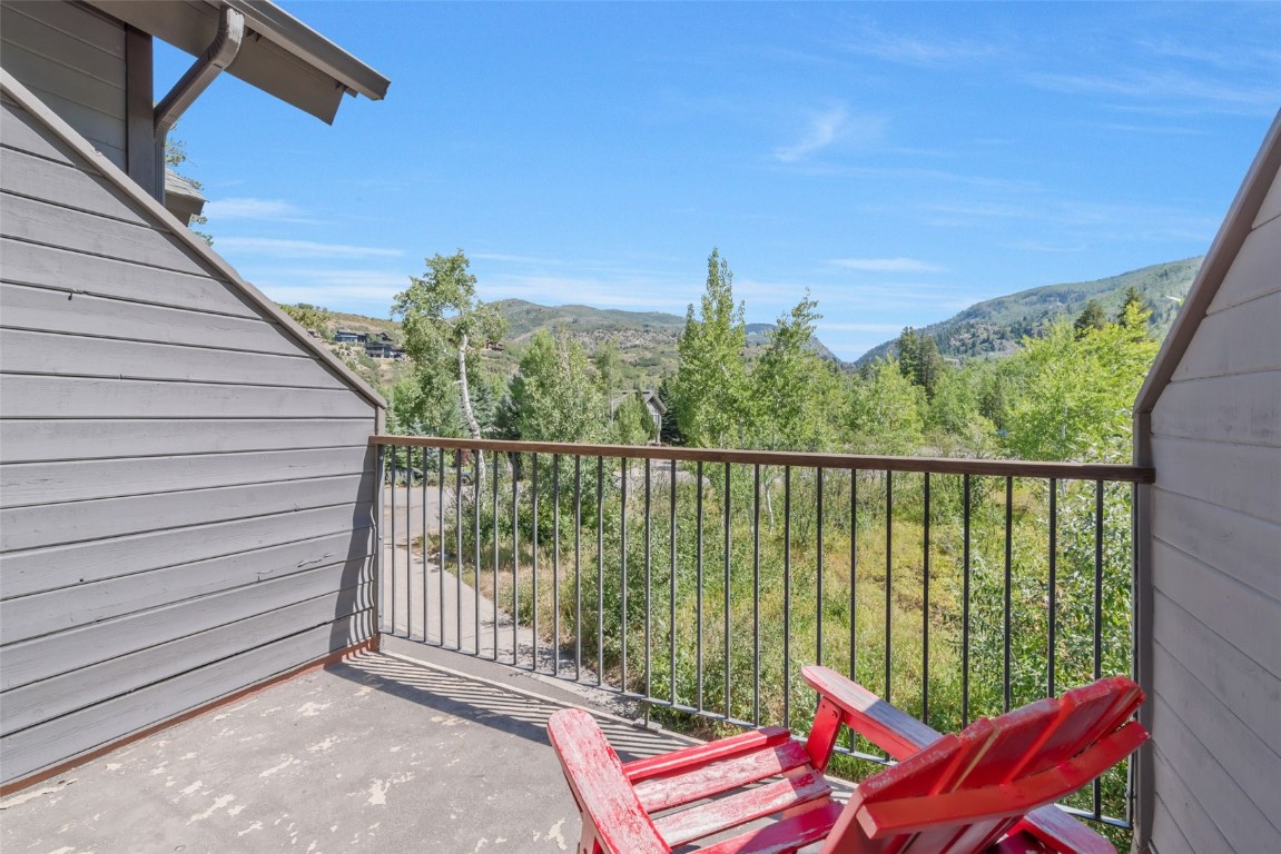 2911 Inverness Way Steamboat Springs, CO 80487 - Photo 39 of 43 a balcony with trees in front of it