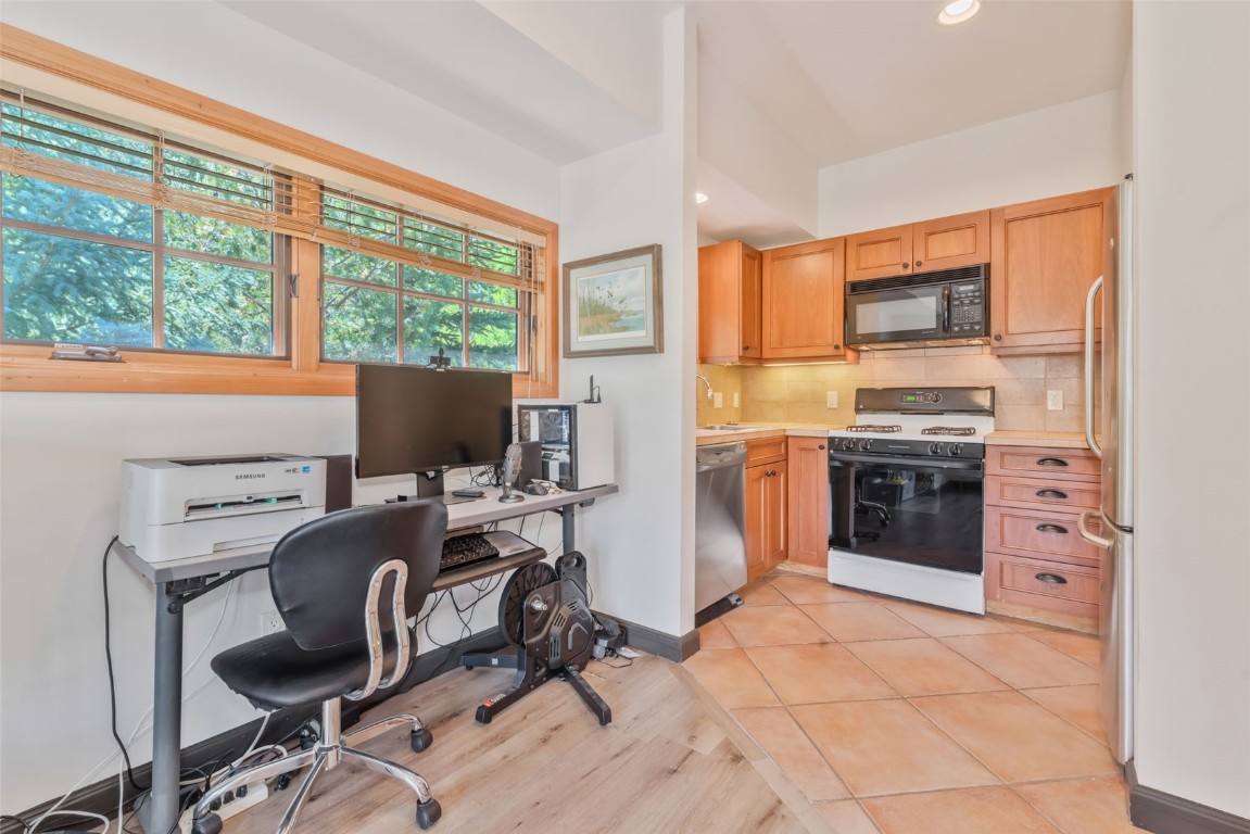 2911 Inverness Way Steamboat Springs, CO 80487 - Photo 40 of 43 a view of a workspace with furniture and a window