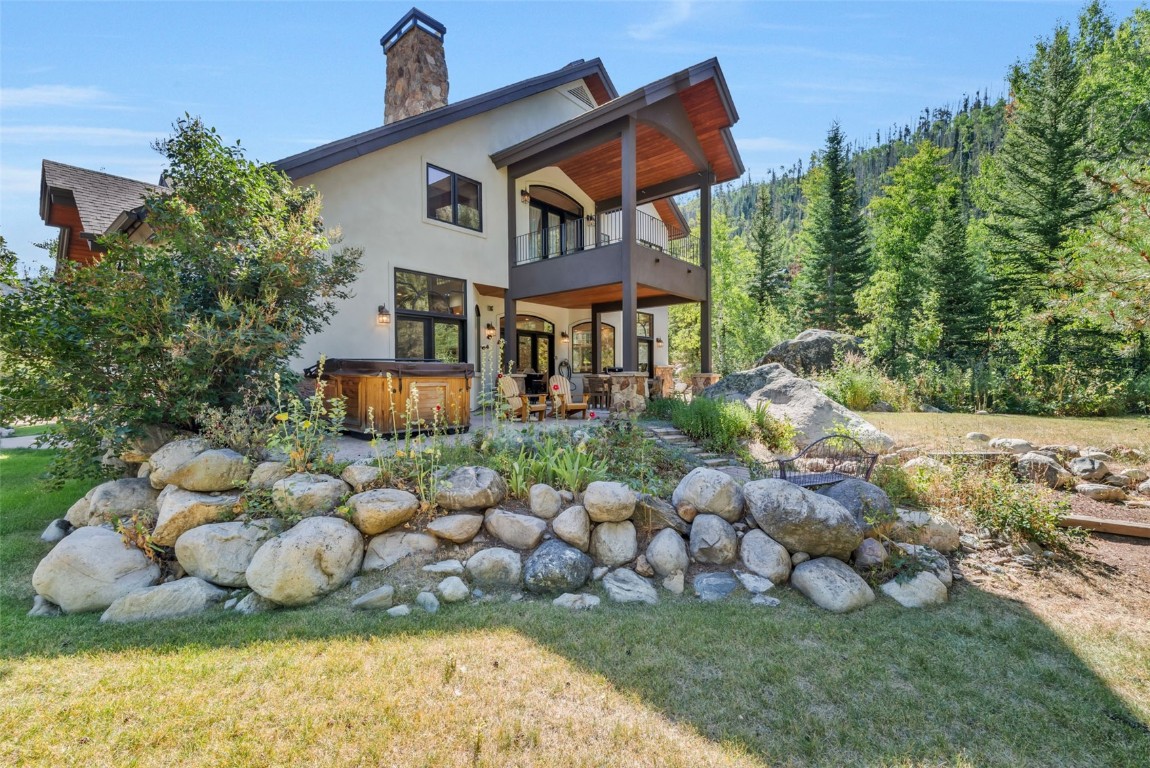 2911 Inverness Way Steamboat Springs, CO 80487 - Photo 4 of 43 a front view of a house with a yard and plants