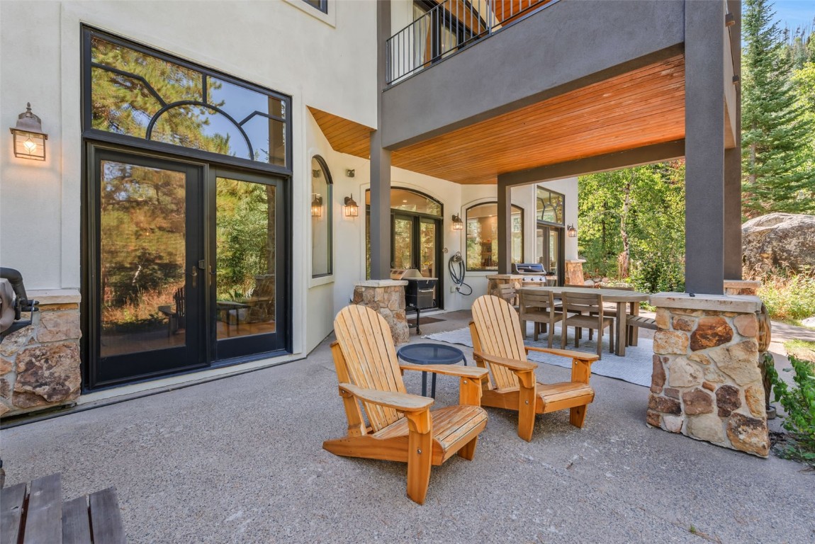 2911 Inverness Way Steamboat Springs, CO 80487 - Photo 5 of 43 a living room with furniture and a floor to ceiling window